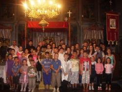 Hristos împărtășit copiilor la parohia „Sfântul Mare Mucenic Gheorghe” din Moldova Nouă